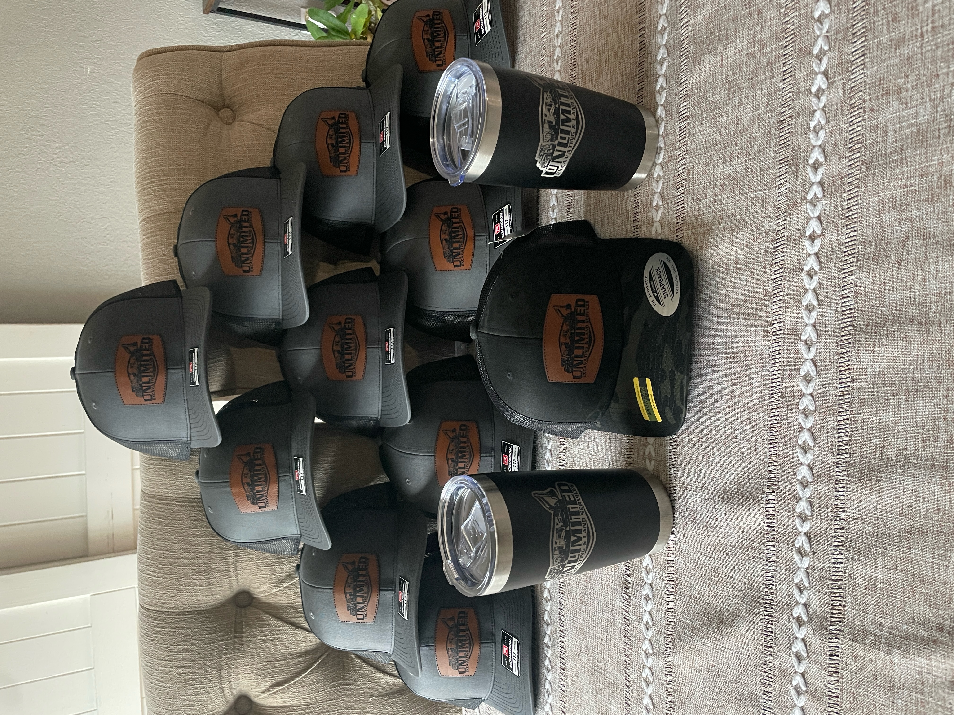 Unlimited Towing bulk order — charcoal Richardson 112 hats and tumblers with leather patches